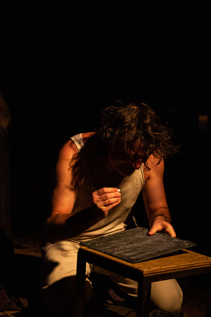 Villon writing on slate